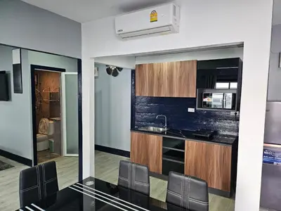 a kitchen with a black counter top and a microwave at Life & Beauty Villa 400m To Beach - Sleeps 7 in Ban Lum Fuang