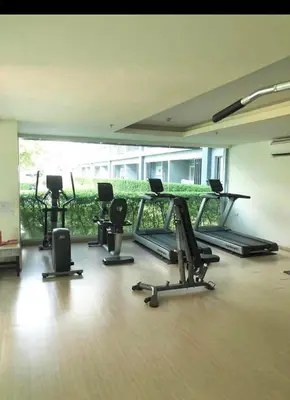 a gym with several treadmills and elliptical machines at The View Condo Monthly Stay Near Central Phuket 30 Day Minimum in Ban Rangeng