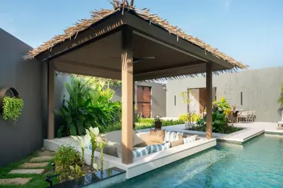a pavilion over a swimming pool in a house at Cocoon Villa 6 - Eden Escape 3 BR - Pool - Garden in Ban Sakhu