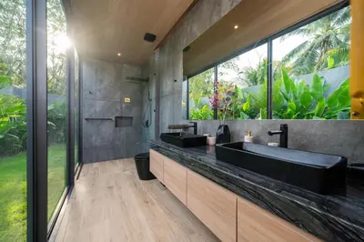 a bathroom with two sinks and a large window at Cocoon Villa 6 - Eden Escape 3 BR - Pool - Garden in Ban Sakhu