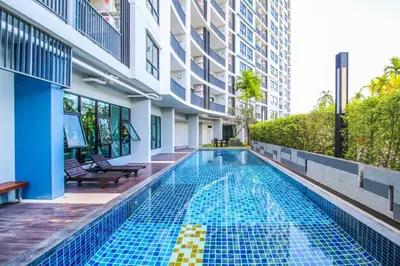 a swimming pool in the middle of a building at Vista Residence Old Town in Phuket Town