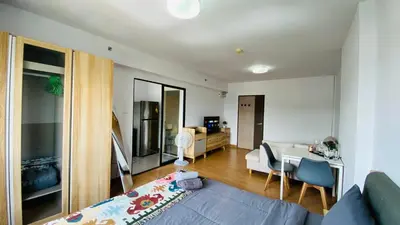 a living room with a couch and a table at Vista Residence Old Town in Phuket Town