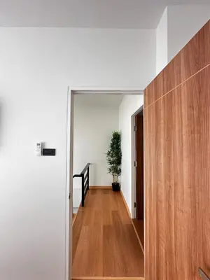 a hallway of a house with a door and a plant at Patong Relax Home in Patong Beach