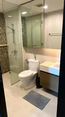 a bathroom with a toilet and a shower and a sink at 1 bedroom apartment Laguna bangtao in Laguna Phuket