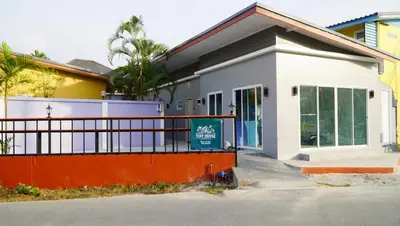a building with a sign in front of it at Tiny house bangtao phuket in Ban Thalat Choeng Thale