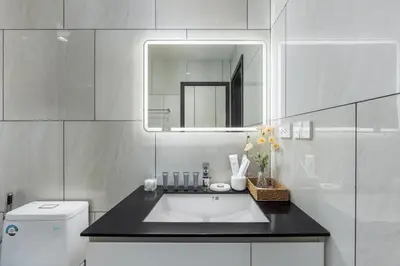 a white bathroom with a sink and a mirror at Vela 1BR Suite — The Title Legendary BangTao in Bang Tao Beach