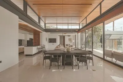 a dining room and kitchen with a table and chairs at Zavaya Luxury Villa by 87Homes in Layan Beach