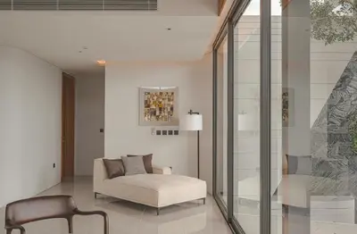 a living room with a couch and a chair at Zavaya Luxury Villa by 87Homes in Layan Beach