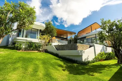 a house with a lawn in front of it at Zavaya Luxury Villa by 87Homes in Layan Beach