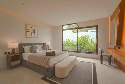 a bedroom with a bed and a large window at Zavaya Luxury Villa by 87Homes in Layan Beach