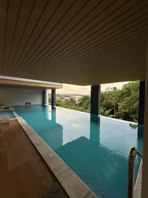 a swimming pool with a view of the water at VIP Great Hill Airport in Nai Yang Beach