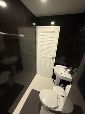 a bathroom with a toilet and a sink and a shower at VIP Great Hill Airport in Nai Yang Beach
