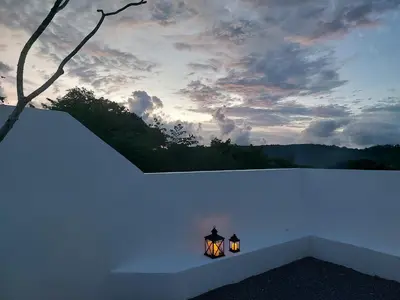 a light on a white wall with a sky at Seaview Swimming pool Villa118-1 in Ban Ao Makham
