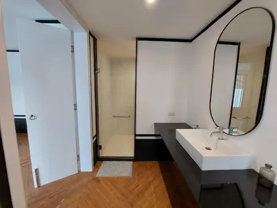 a bathroom with a white sink and a mirror at Seaview Swimming pool Villa118-1 in Ban Ao Makham