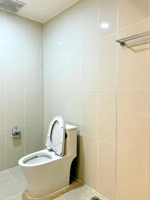 a bathroom with a toilet with the lid up at Harmony House in Ban Bang Khu