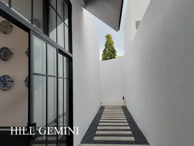 a stairway leading into a white building with a tree at Wild Seaview Swimming pool Villa118 in Phuket Town