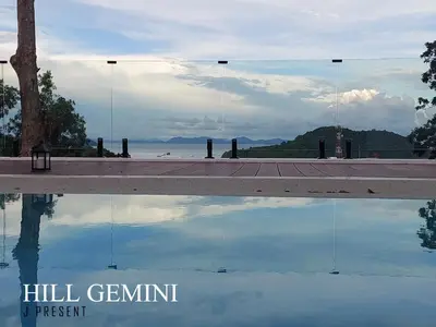 a reflection of the sky in a pool of water at Wild Seaview Swimming pool Villa118 in Phuket Town