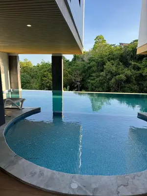 a swimming pool in the middle of a building at Апартаменты VIP Great Hill Най - Янг in Nai Yang Beach