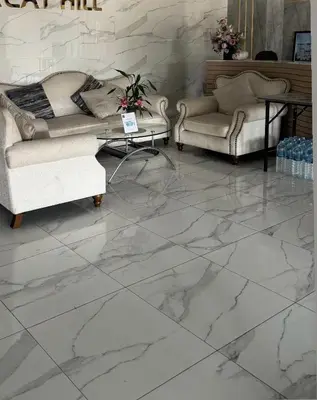a living room with white marble floors and couches at Апартаменты VIP Great Hill Най - Янг in Nai Yang Beach