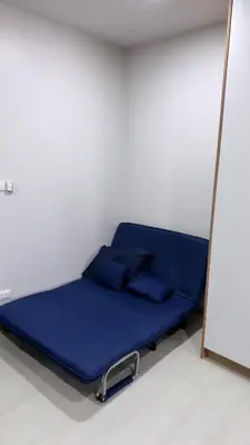 a bed in a room with a mirror at Апартаменты VIP Great Hill Най - Янг in Nai Yang Beach