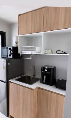a kitchen with a sink and a refrigerator at Апартаменты VIP Great Hill Най - Янг in Nai Yang Beach