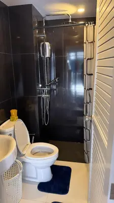 a bathroom with a toilet and a shower and a sink at Апартаменты VIP Great Hill Най - Янг in Nai Yang Beach