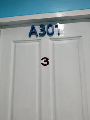 a door with a sign on top of it at Bedroom301 Kata Beach Phuket in Kata Beach