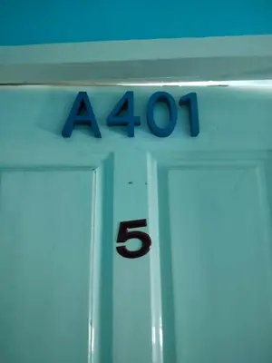 a sign with the number on top of a door at Bedroom401 Kata Beach Phuket in Kata Beach