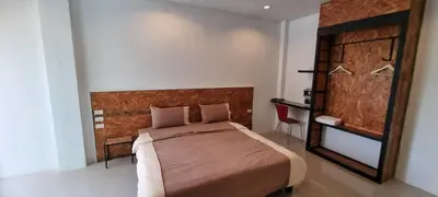 a bedroom with a large bed in a room at Sawadee632,Naiharn&Rawai Beach Phuket in Phuket Town
