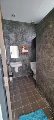 a bathroom with a sink and a toilet at Sawadee632,Naiharn&Rawai Beach Phuket in Phuket Town