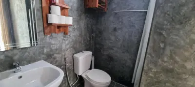 a bathroom with a white toilet and a sink at Sawadee632,Naiharn&Rawai Beach Phuket in Phuket Town
