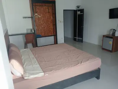 a bedroom with a bed in a room at Sawadee632,Naiharn&Rawai Beach Phuket in Phuket Town