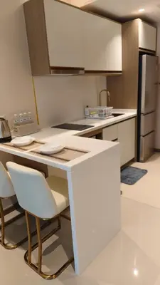 a kitchen with a white counter and a refrigerator at Luxury 2 Person Apartment in Heart of Phuket 2 in Ban Ket Ho