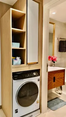 a kitchen with a washing machine in a cabinet at Luxury 2 Person Apartment in Heart of Phuket 2 in Ban Ket Ho