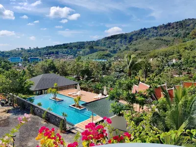 an aerial view of a villa with a swimming pool at 1 bedroom apartment - 2 min to the Nai Harn beach in Rawai Beach