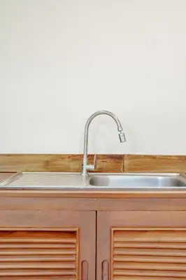 a stainless steel kitchen sink with a faucet at 1 bd Villa - 2 minutes to the Nai Harn beach A101, A102 in Rawai Beach