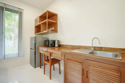 a kitchen with a counter and a sink and a refrigerator at 1 bd Villa - 2 minutes to the Nai Harn beach A101, A102 in Rawai Beach
