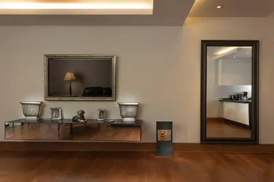a room with a mirror and a table with vases at Apartment 100 м2, Naithon beach in Phuket