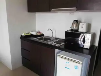 a small kitchen with a sink and a microwave at C257 Studio Seaview Near Beach Pool & Gym View in Patong Beach