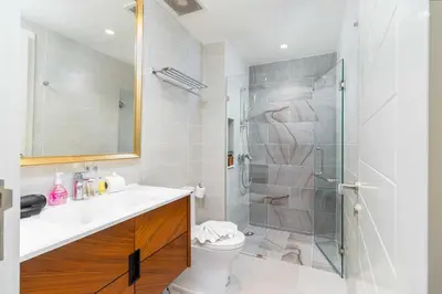 a bathroom with a shower and a toilet and a sink at C261 Work Play & Stay City 1BR Condo Poo l& Gym in Kathu