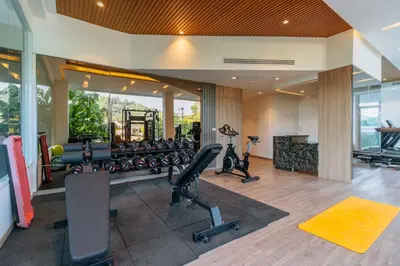 a gym with treadmills and exercise equipment in a house at C261 Work Play & Stay City 1BR Condo Poo l& Gym in Kathu