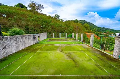 an old tennis court with a tennis racket at Royal Legacy Golf Private Villa in Rawai Beach