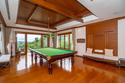 a living room with a pool table in it at Royal Legacy Golf Private Villa in Rawai Beach