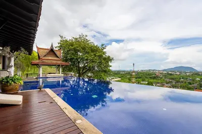 a swimming pool with a view of a city at Royal Legacy Golf Private Villa in Rawai Beach