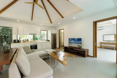 a living room with a couch and a table at 3BR Pool Villa near Rawai Beach - Villa Kamana in Rawai Beach