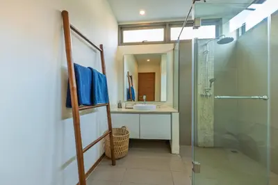 a bathroom with a shower and a sink and a mirror at 3BR Pool Villa near Rawai Beach - Villa Kamana in Rawai Beach