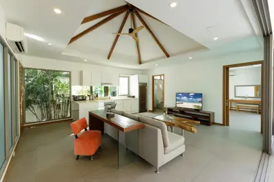 a living room with a couch and a table at 3BR Pool Villa near Rawai Beach - Villa Kamana in Rawai Beach
