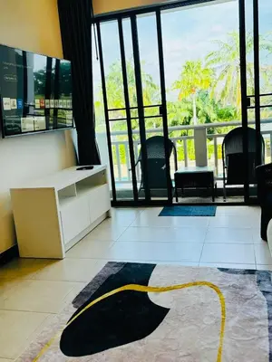 a lobby with a desk and chairs and a large window at Allamanda 2 lake side pad in the heart of Laguna in Laguna Phuket
