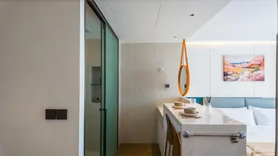 a bathroom with a sink and a mirror at Studio 50 meter from Layan Beach in Layan Beach