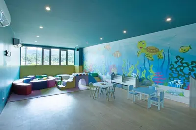a room with an ocean themed room with tables and chairs at Seaview 1BR Apt Oceana C36 near Kamala Beach in Kamala Beach